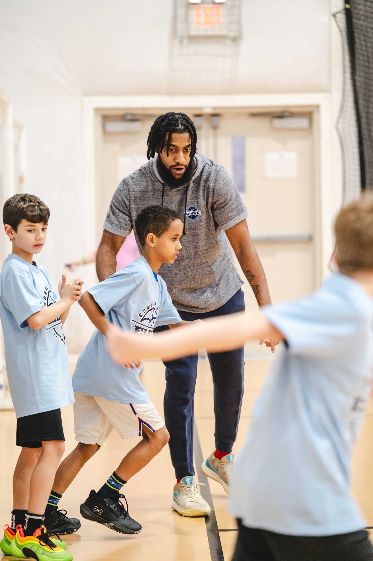 CT Elite coach leading a youth basketball drill